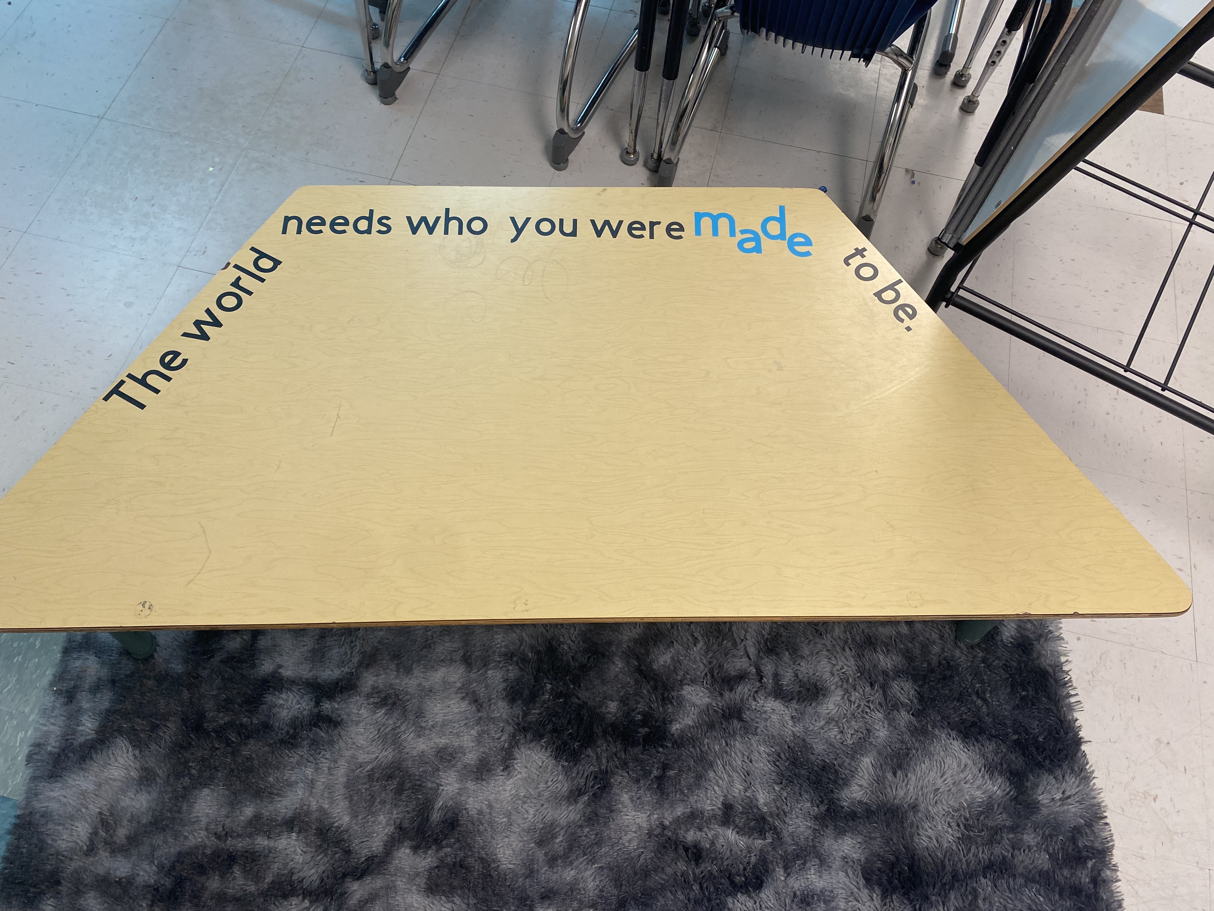 Hand-painted classroom table with motivational quote