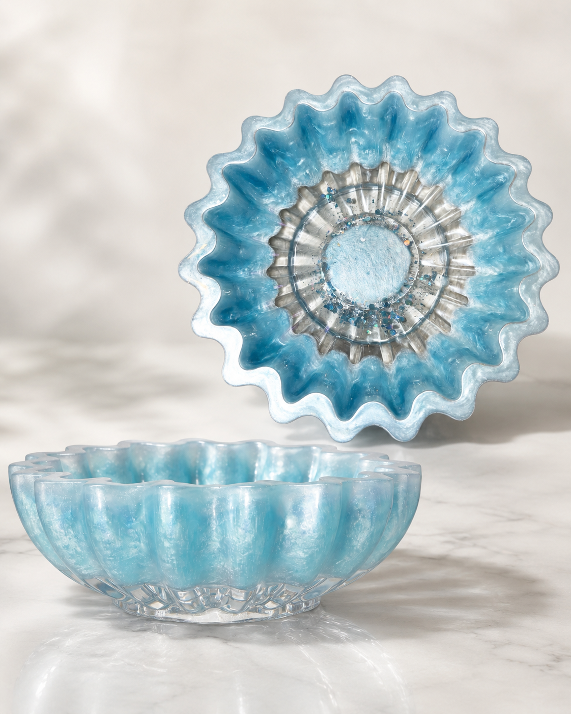 Pearlescent ocean-blue scalloped resin dish with sparkling glitter accents